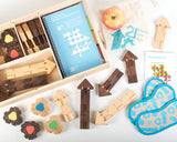 A top view of the wooden puzzle pieces, blindfolds, and map which make up the The Empathy Toy Teacher's Kit for play-based learning.